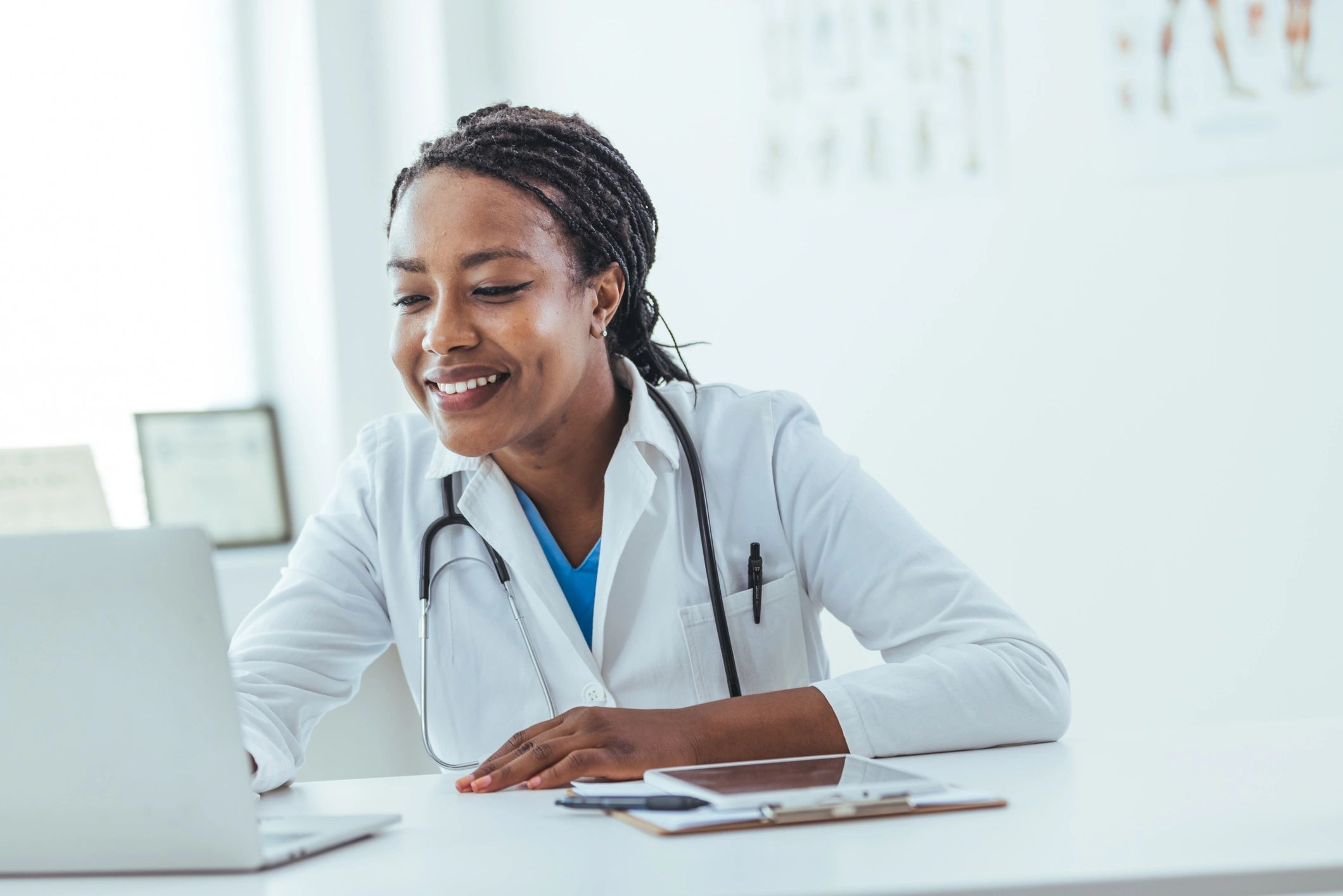 Doctor working on a laptop in a clinic