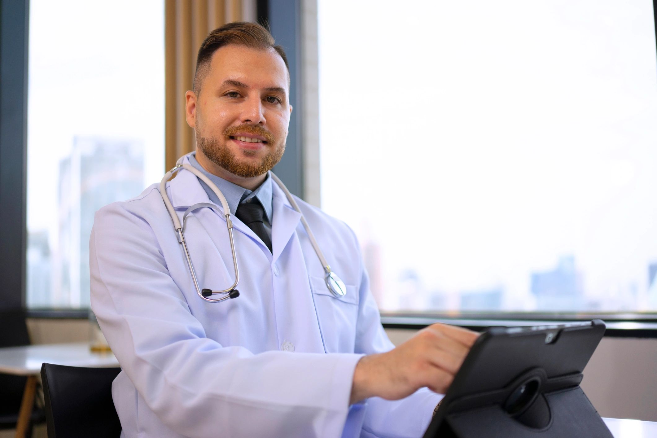 Doctor using a digital tablet during an online healthcare consultation